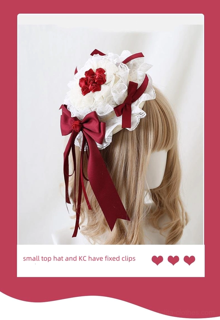 Lolita small top hat hair accessory Polaroid-styled display on blonde curly wig mannequin with white lace base central red fabric flower and wine-red satin bows featuring fixed clip retaining mechanism