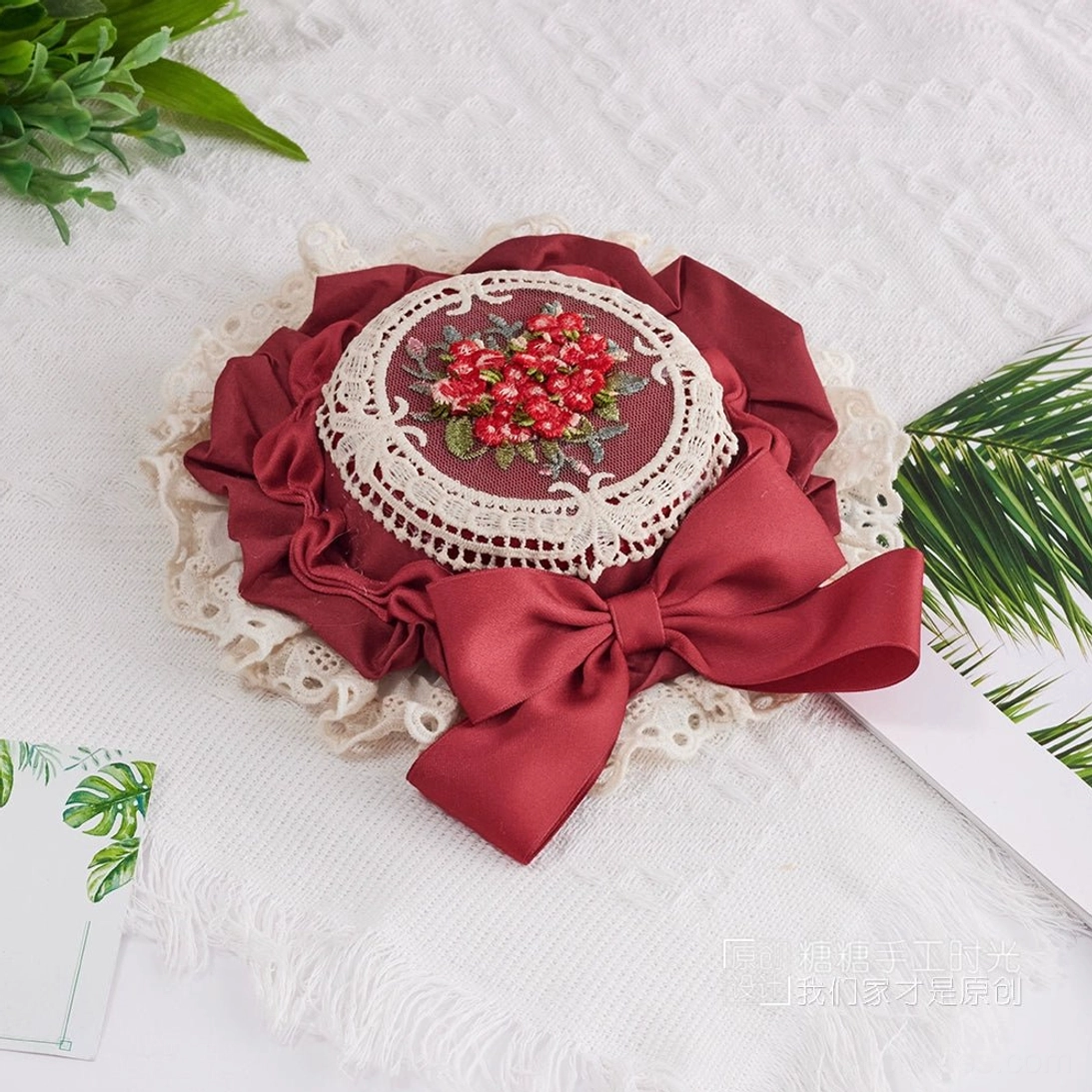 Romantic Lolita miniature top hat with satin ribbon bow, delicate hand-stitched floral embroidery, and cotton lace ruffled trim for Sweet Lolita coords