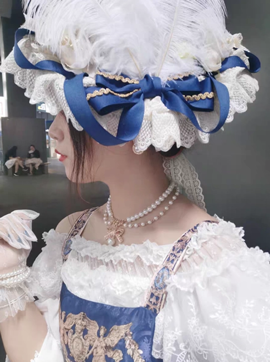 Lolita fashion model close-up side portrait wearing feather hat with blue ribbon bow and multiple pearl necklaces layered, indoor public lounge background, kawaii accessories styling, half-body shot
