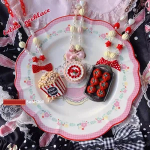 Red bow beaded Lolita necklace with mixed dessert charms displayed on gingham lace backdrop