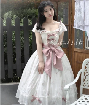 Sweet Lolita OP Dress Half-Body Front View with Large Pink Waist Bow and Lace-Up Front on White Garden Patio