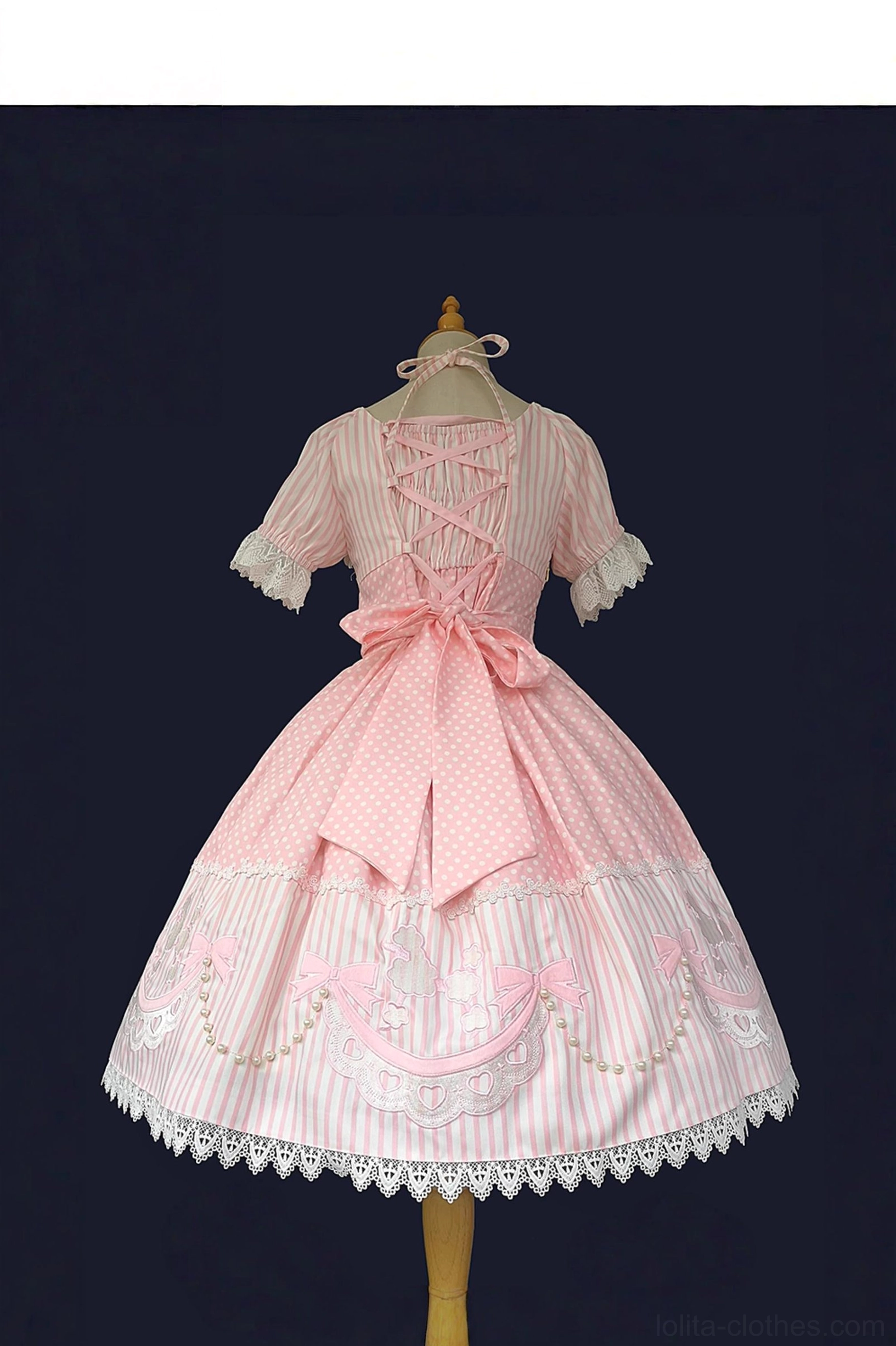 Back view of pink striped old school lolita OP dress showing lace-up back closure, adjustable back shirring, large back waist bow, and lace-trimmed puff short sleeves