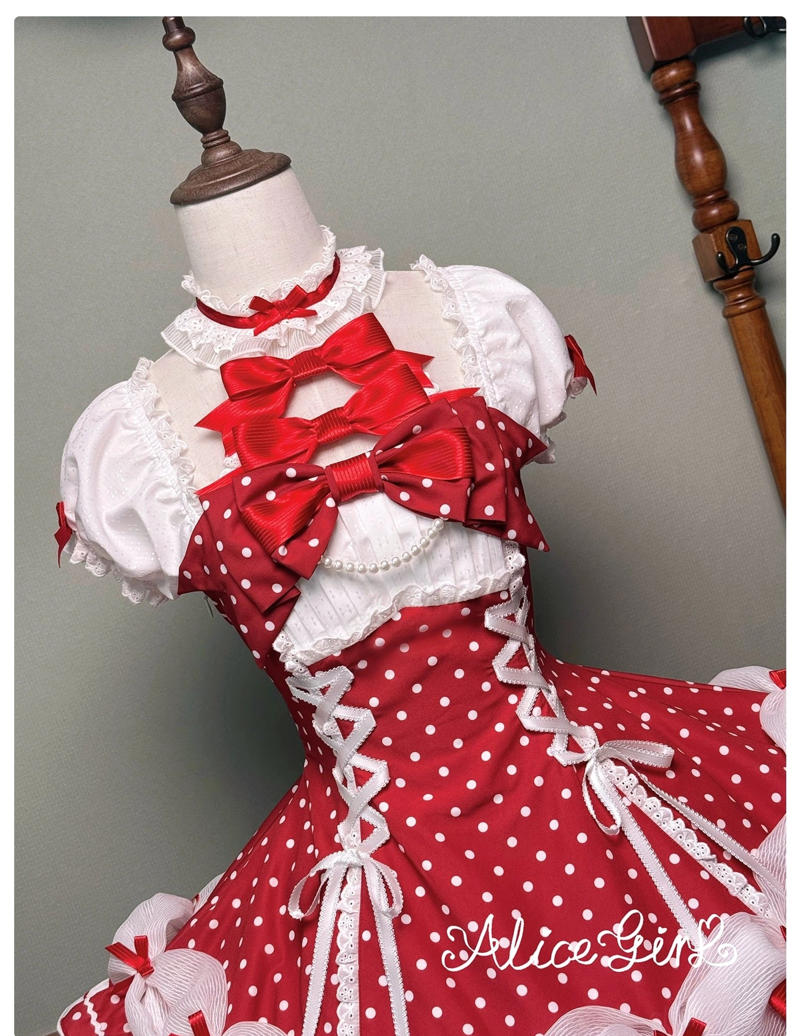 Lolita OP dress back waist removable bow showing attachment and removal mechanism for styling flexibility