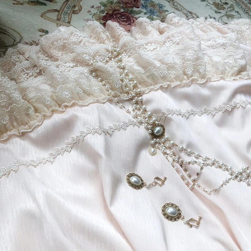 French Lolita one-piece dress with cameo brooch showing vintage-inspired jewelry accessory option