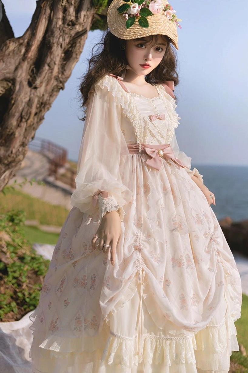 Lolita OP dress medium close-up front shot showing subtle floral patterns, pink waist bow, ruffled sleeve cuffs, square ruffled neckline, fitted draped bodice construction detail