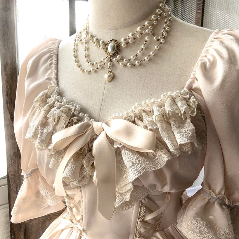French Lolita one-piece dress with delicate pearl necklace showing elegant jewelry coordination