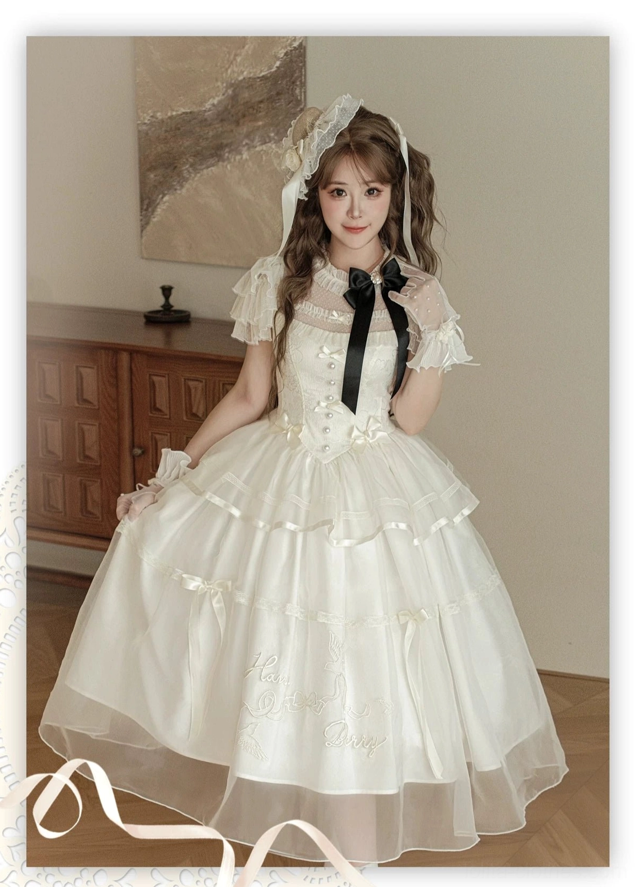 Milky apricot classic lolita OP dress detail shot showing embroidered tulle layers, black bow decoration, and jacquard fabric texture close-up