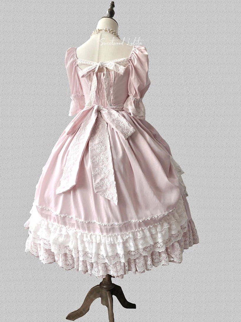 French Lolita one-piece dress showing fabric movement and drape quality in action photography