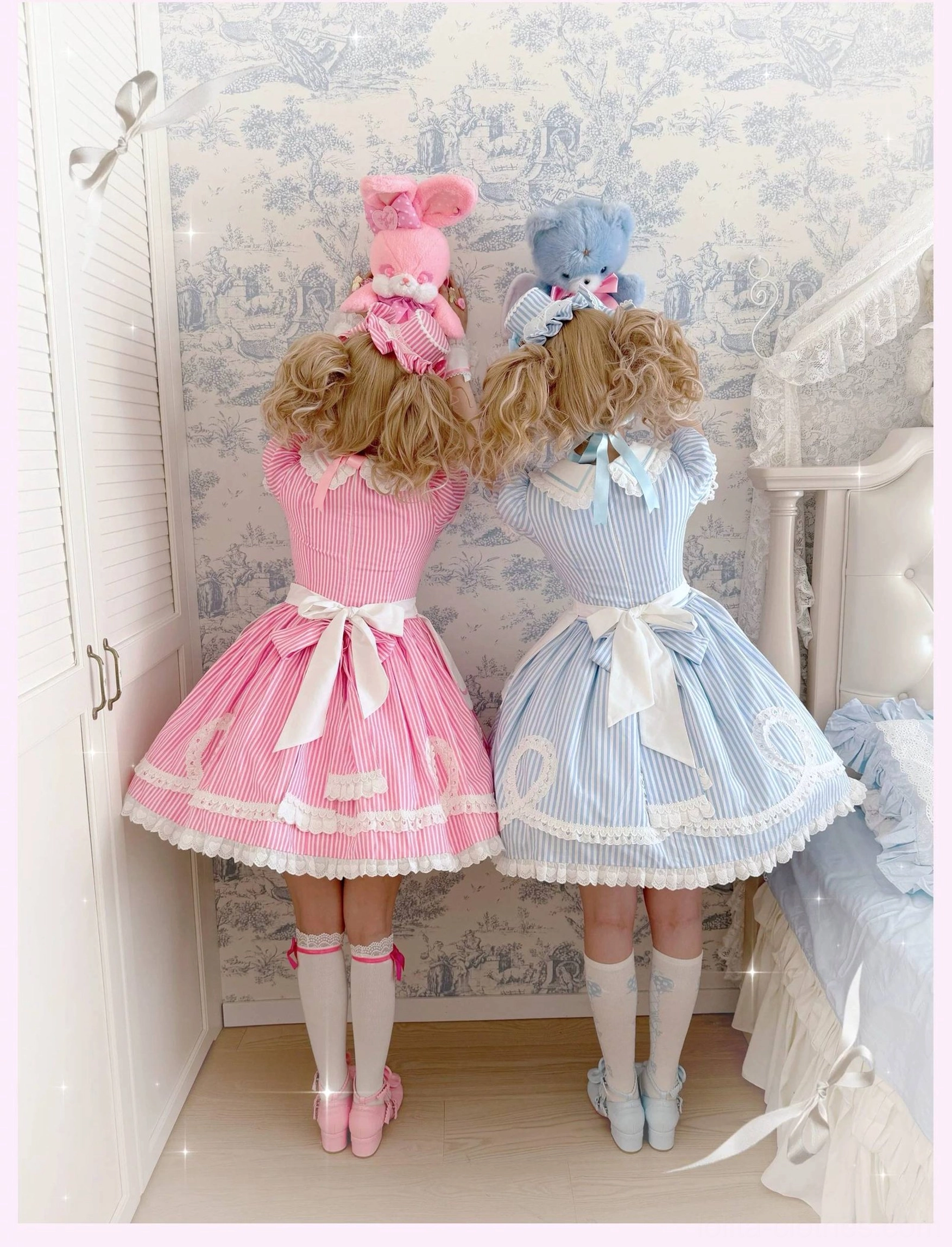 Close-up detail of heart-shaped button cuffs and lace trim on old school lolita OP dress showing craftsmanship and design elements