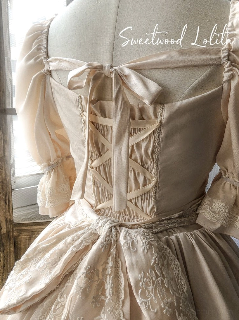 French Lolita one-piece dress showing how minimalist jewelry maintains dress's intricate detail focus