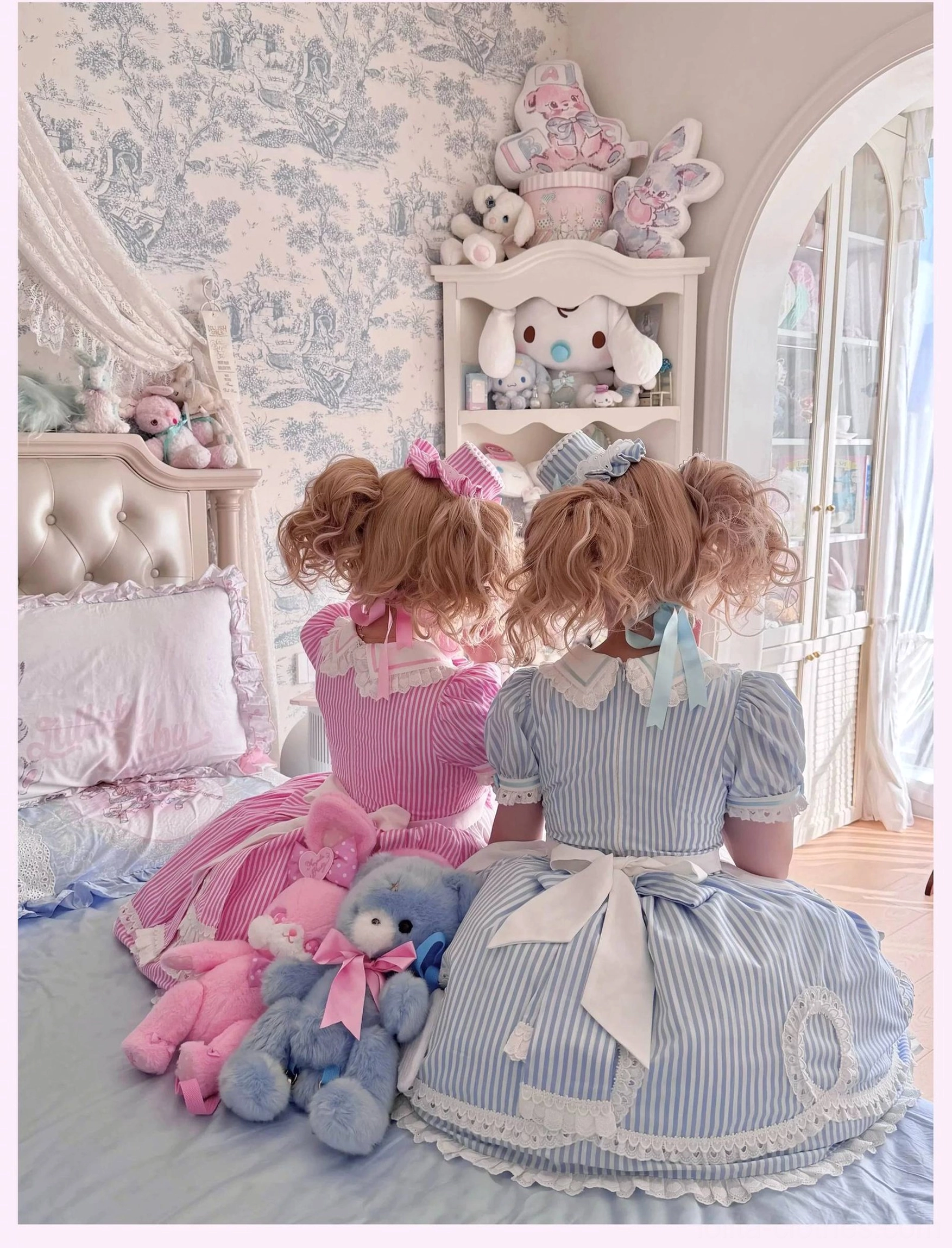 Detail view of satin bow at neckline and white lace trim on striped old school lolita OP dress front bodice area