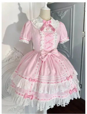 Lolita OP dress three-quarter front view showcasing puff short sleeves, satin bow decorations, delicate lace trim at neckline, and multi-layered ruffled lace hem design