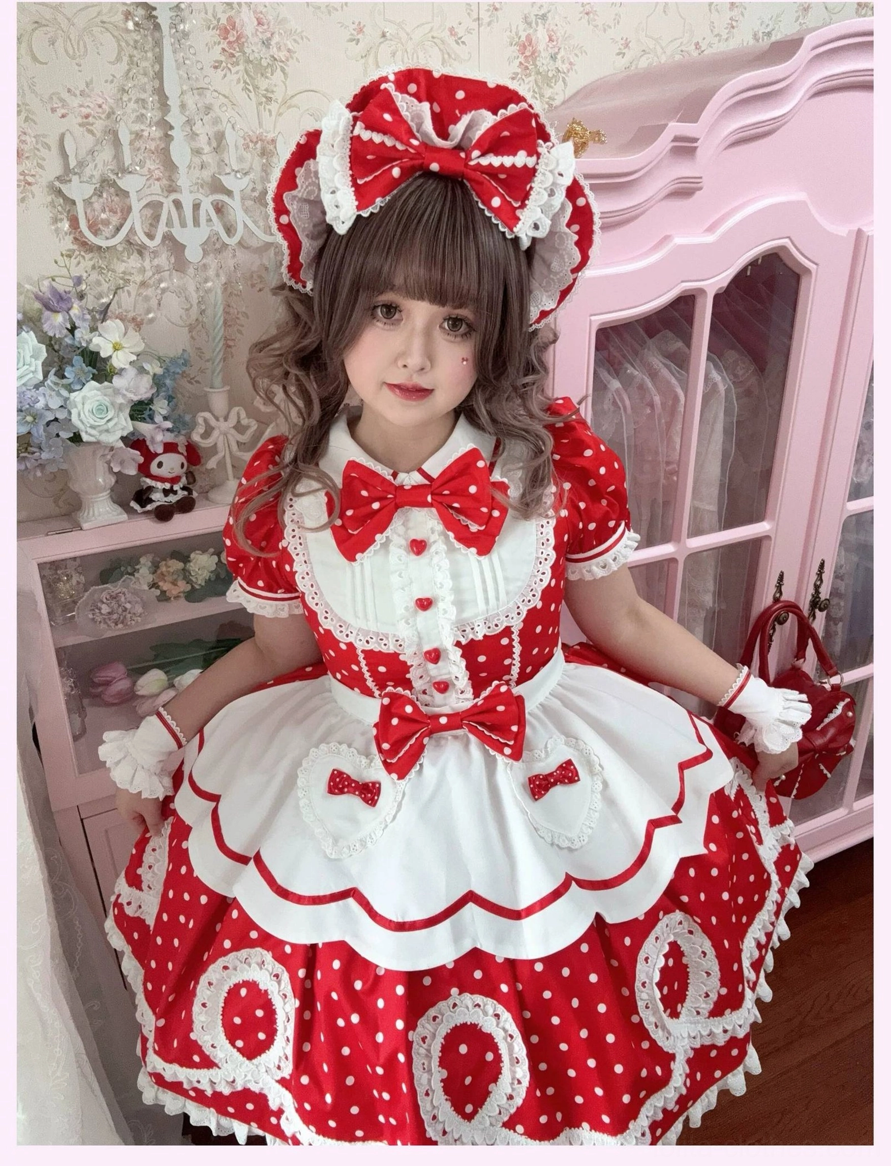Sleeve and cuff detail of lolita OP dress showing heart-shaped button design and fabric quality