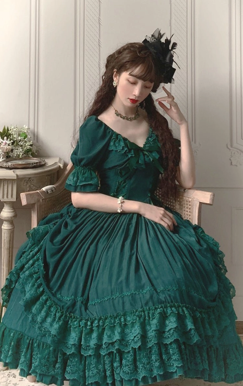 French Lolita one-piece dress styled with structured handbag and vintage accessories for complete outfit