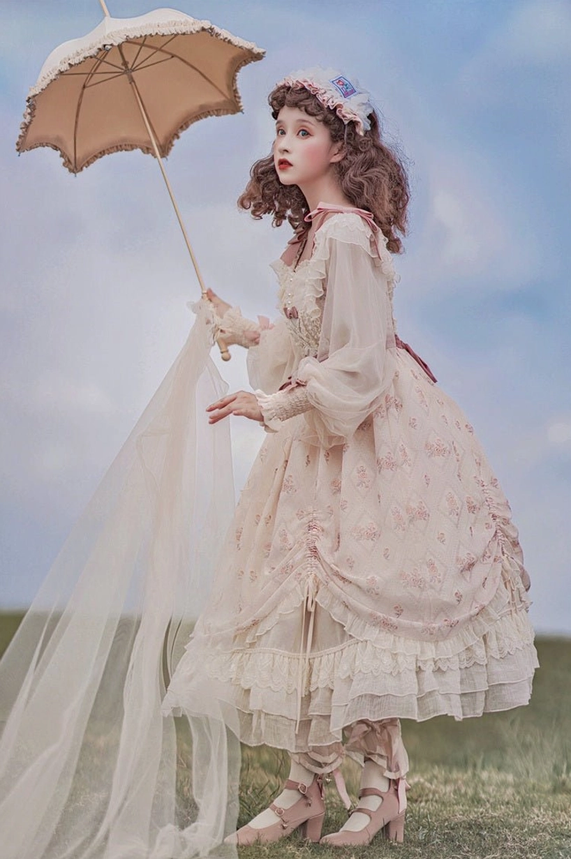 Lolita OP dress vintage aesthetic outdoor setting showing dress worn in scenic location, seaside backdrop, cultural context of lolita fashion wear