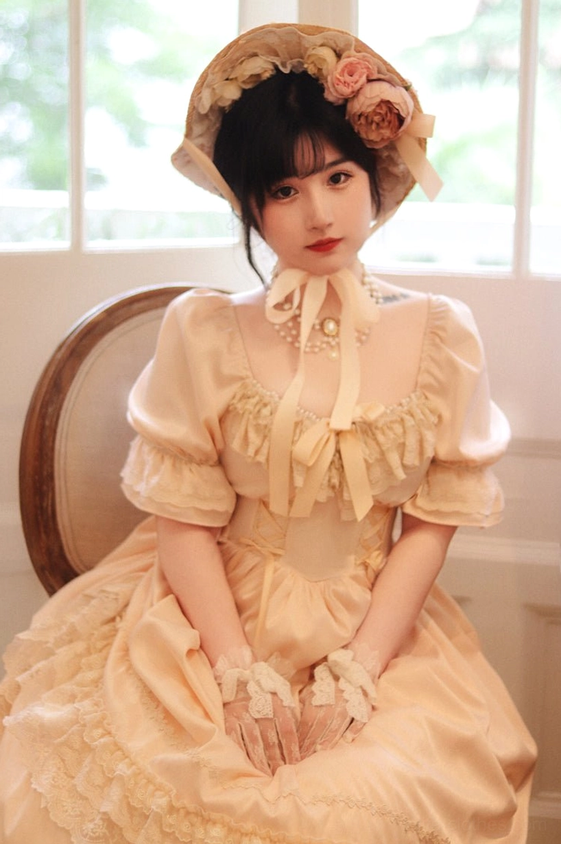 French Lolita one-piece dress with vintage-inspired bow hair accessories coordinating for complete aesthetic