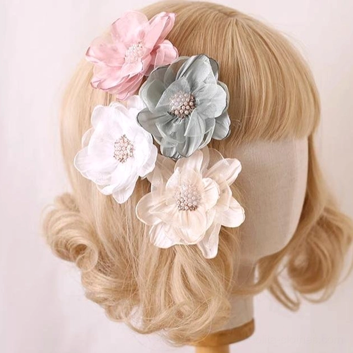 Lolita flower hairpins worn on mannequin head blonde wig side view wearing demonstration