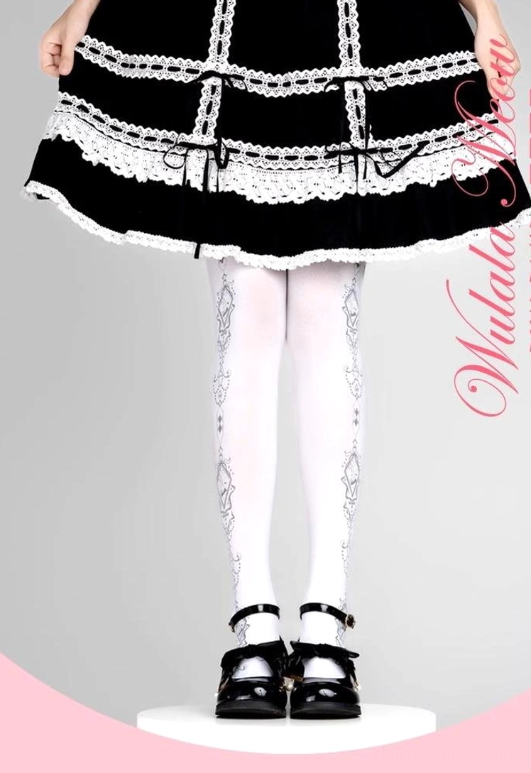 Full leg straight-on view of opaque white Lolita pantyhose with intricate black retro geometric prints paired with classic black-white Lolita coordinate