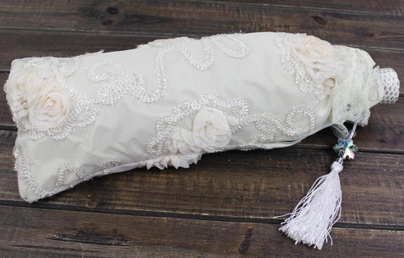 Additional product detail view of cream white lolita parasol with intricate 3D rose lace appliques, scalloped ruffled lace border, demonstrating vintage-inspired rococo aesthetic and delicate craftsmanship