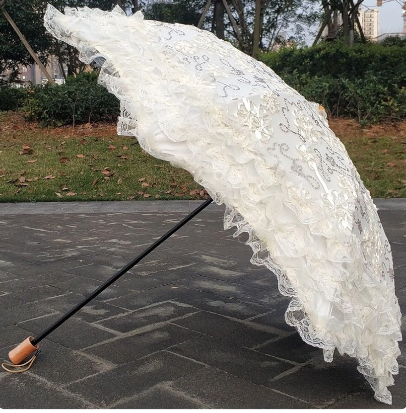 Lolita parasol collection showing all available color options ivory pink black white displayed together demonstrating style versatility and color coordination choices