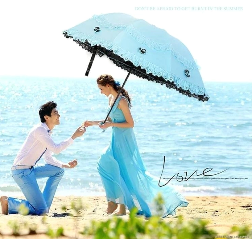 Foldable lolita parasol metal handle detail with hanging strap attachment and refined craftsmanship, showing durability and functionality