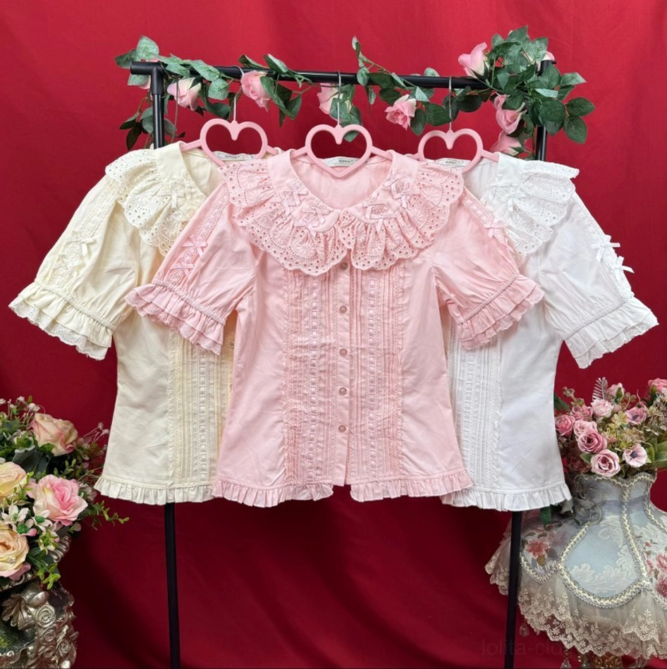 Multiple color variants of Sweet Lolita blouses beige pink white Peter Pan collar blouses with lace ruffled details overhead view