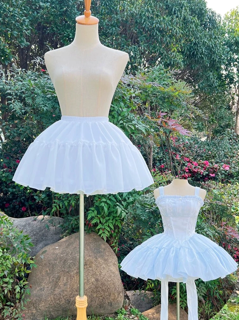 Comparison two white lolita petticoats blue lolita dress side view mannequins outdoor garden puffiness demonstration
