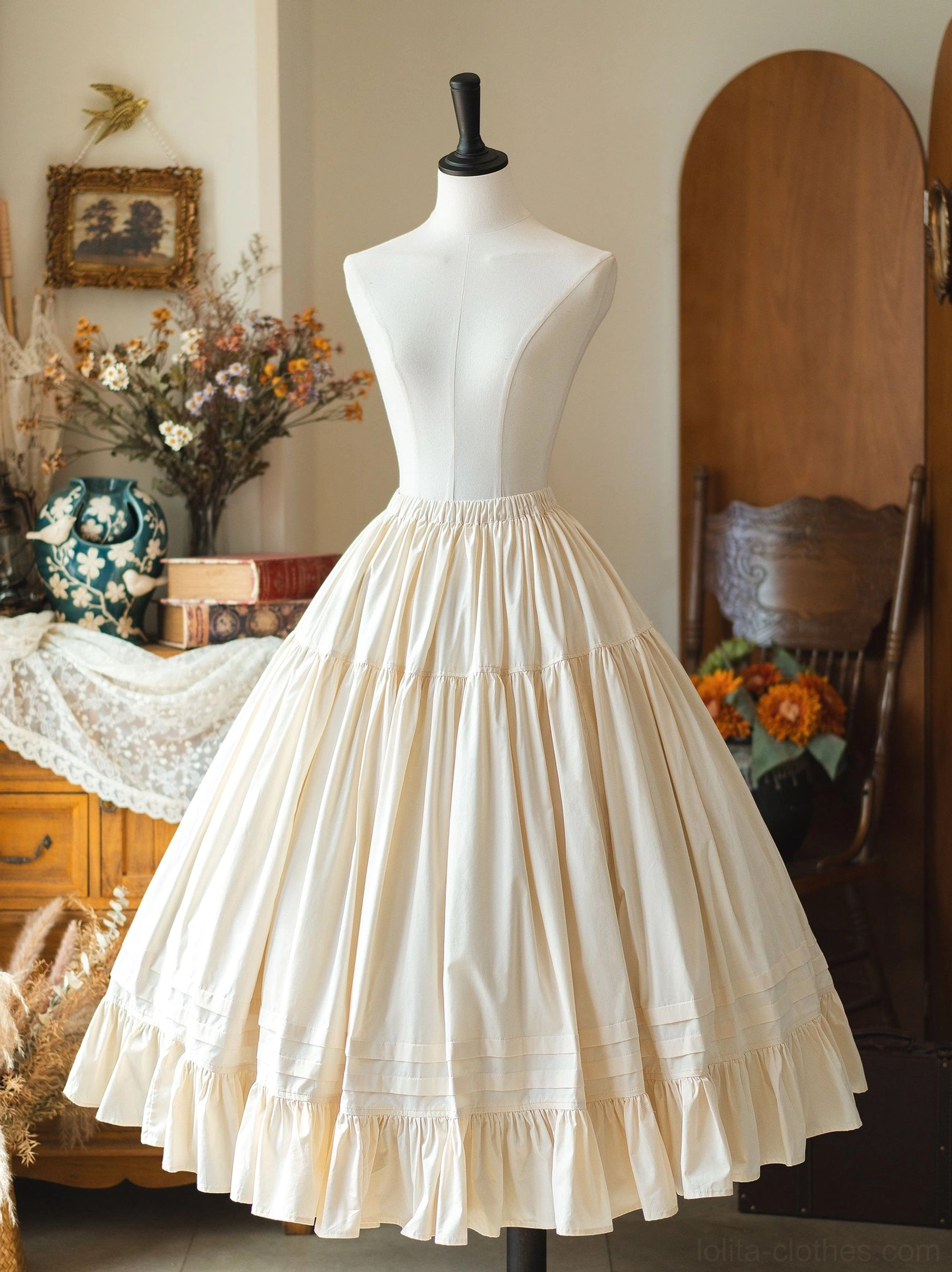 Cream white ruffled Lolita petticoat skirt with high waist full A-line cut and layered ruffled hem on dress mannequin