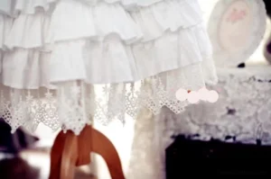 lolita petticoat embroidered scalloped lace hem detail tiered cotton ruffles close-up