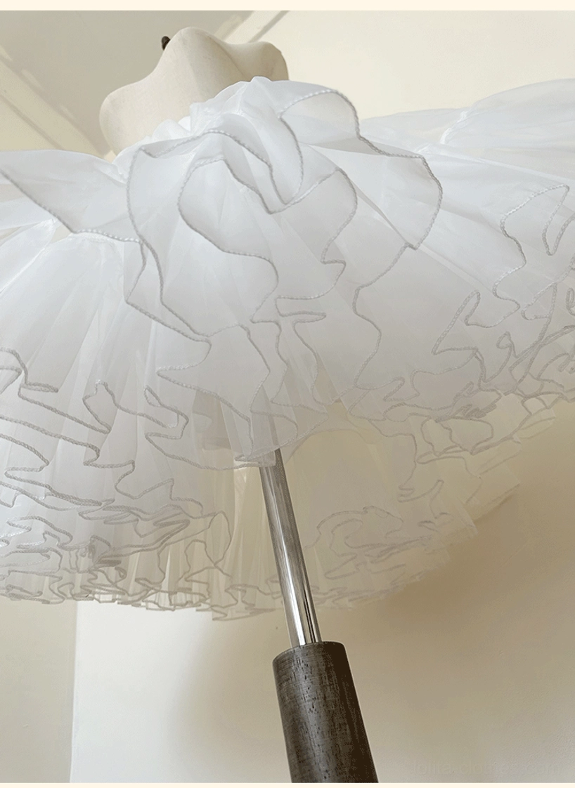Lolita petticoat hem detail side close-up view showing delicate wavy layered ruffled tulle trim texture and soft sheer fabric construction