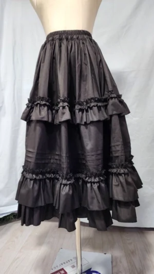 Three-quarter side view of ruffled Lolita petticoat on dress form, highlighting gathered ruffle details and graceful skirt drape