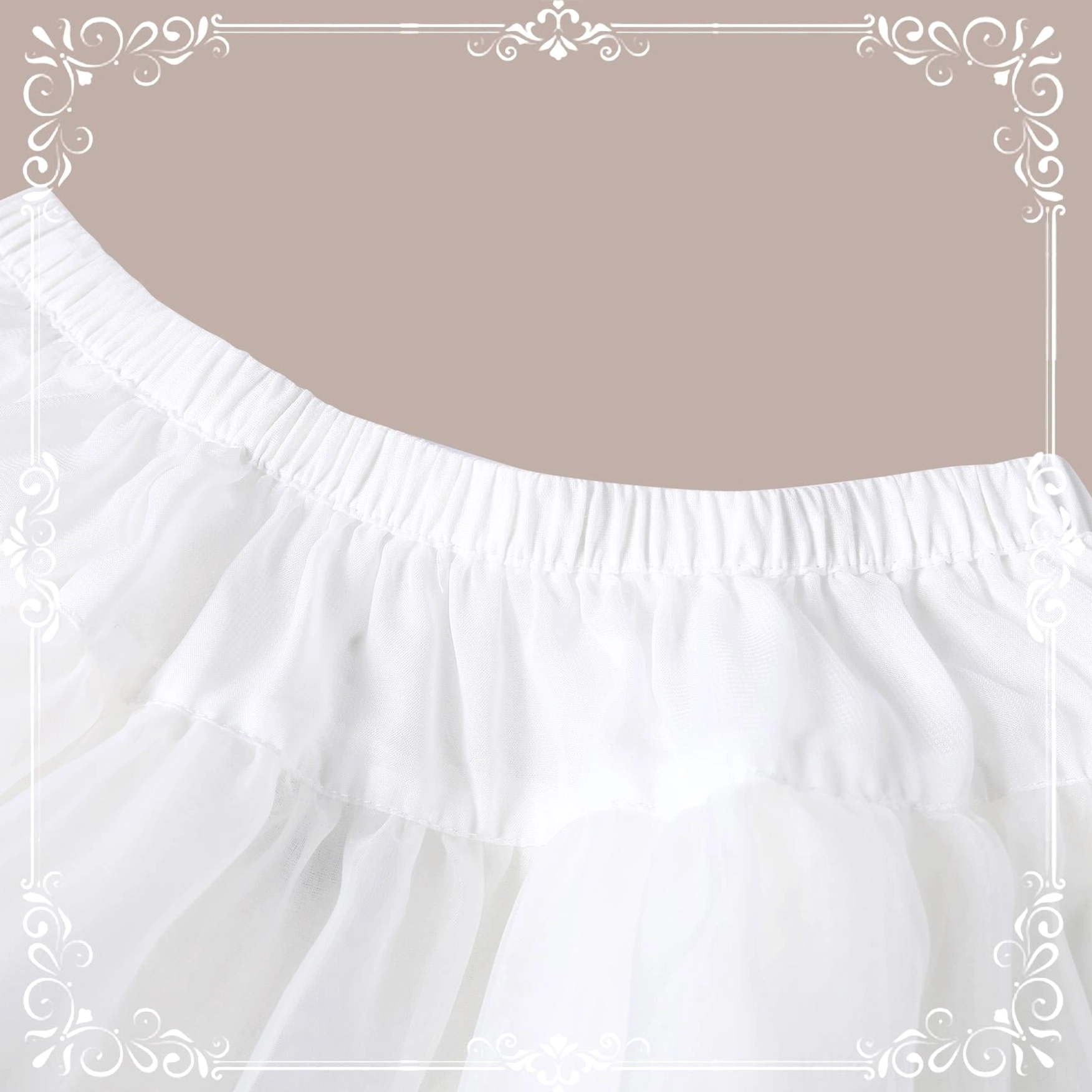 Close-up side view of lolita petticoat waist area flat lay showing wide soft elastic waistband and layered fluffy tulle fabric construction