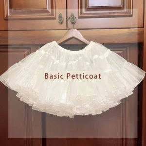 Essential lolita petticoat hanging display showing white tiered ruffled tulle structure with elastic drawstring waist against wooden cabinet backdrop front view