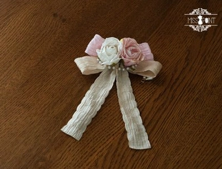 pink lolita hair clip accessory with soft pastel color delicate lace trim and floral embellishments