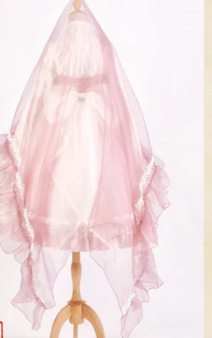 Lolita pink tulle veil headdress with ruffled lace hem on white mannequin display front view ethereal fairy-tale bridal style