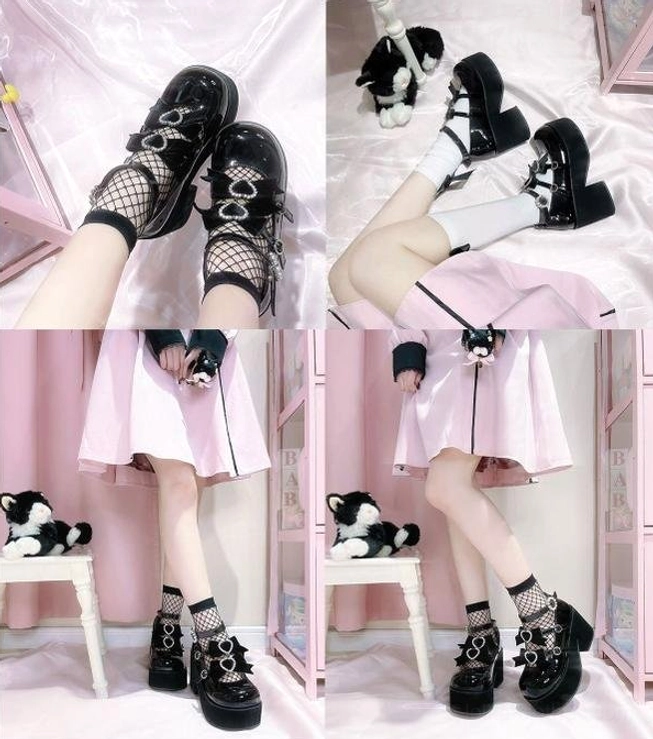 Lolita platform heel shoes top view overhead showing heart buckle placement patent leather surface glossy finish design layout