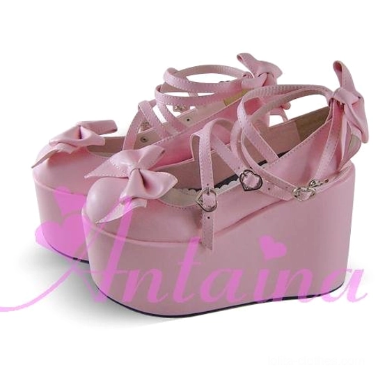 Lolita platform shoes heart buckle detail macro shot showcasing ornate heart-shaped metal hardware, decorative buckle design, and attachment to cross ankle straps
