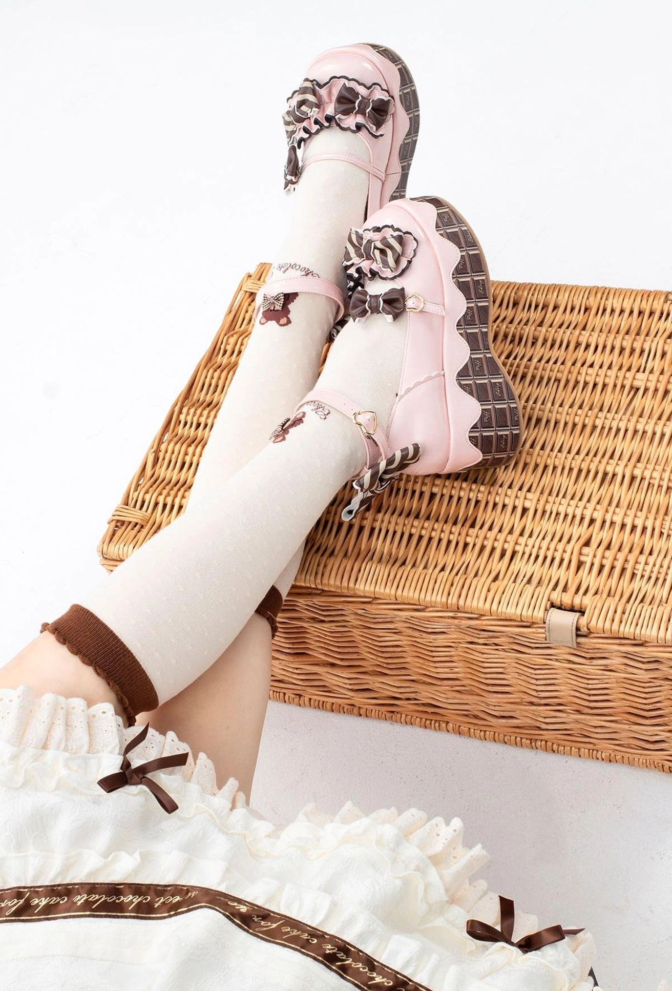 Light pink sweet lolita platform shoes with ankle strap design bowknot decorations and chocolate-striped thick sole back view on-foot wear white socks