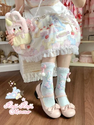 Sweet lolita rabbit print mid-calf socks worn on lower body with over-shoulder model view, paired with printed lolita dress, bunny crossbody bag, and pink mary jane shoes, showcasing pom-pom and bow sock cuff decoration and complete kawaii coordinate styling