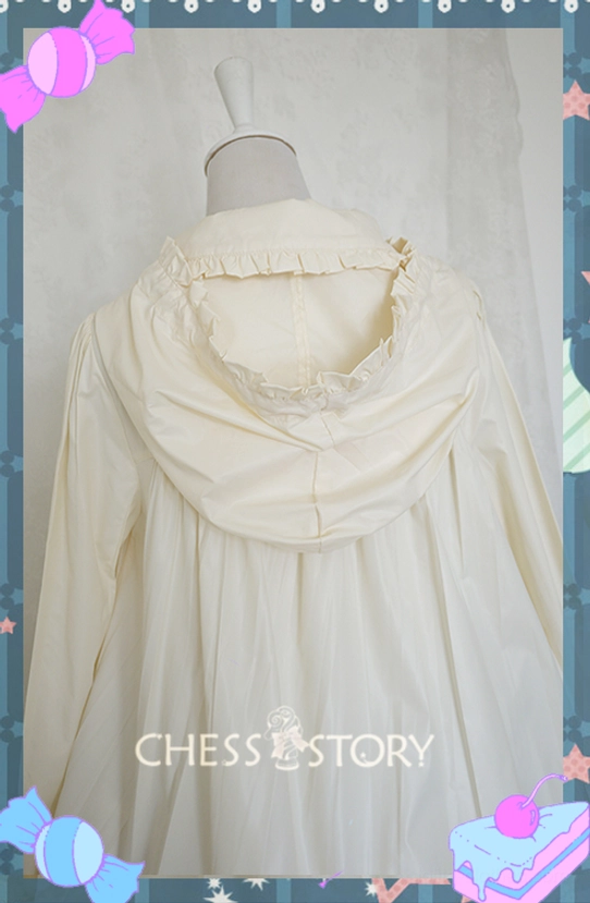 Back close-up hood and Peter Pan collar detail cream Lolita raincoat with ruffled trim around hood opening doll collar and flowy fabric