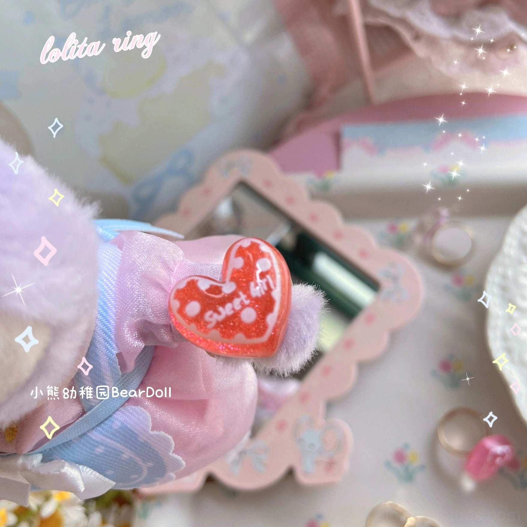Red heart-shaped resin Lolita ring with white dot print pattern gold adjustable band close-up