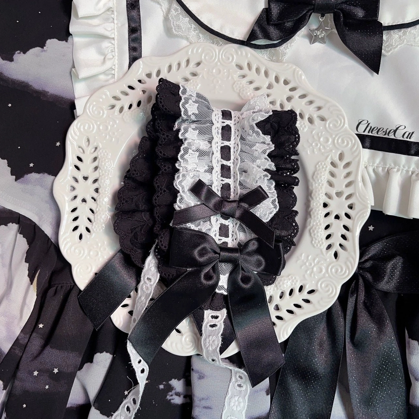 Lolita ruffled lace headband with multiple satin bow embellishments showing craftsmanship and design quality from overhead angle