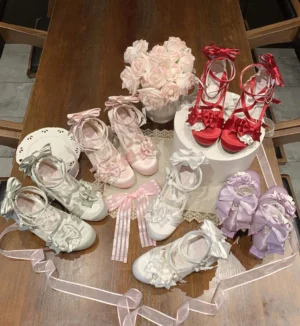 Assorted color Lolita satin mary jane heels including silver, pink, white, red, and lavender options displayed flat lay on wooden table with artificial roses