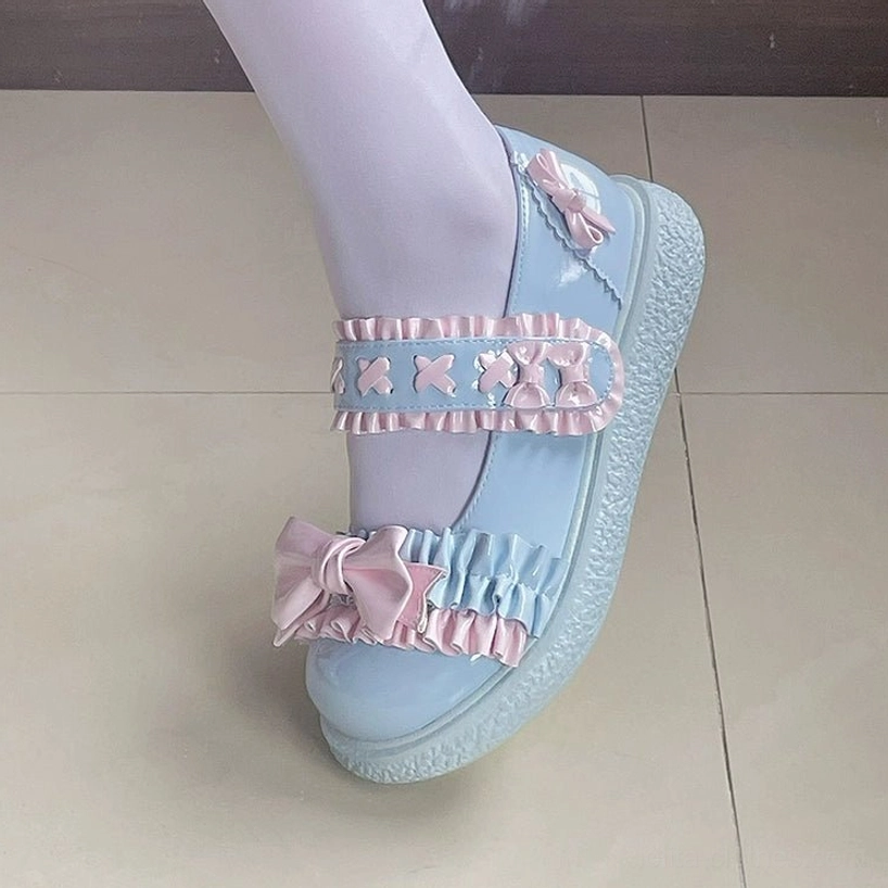 Detailed textile photography of Lolita shoes showing pin tucks embellishment, stitching quality and premium synthetic leather construction craftsmanship