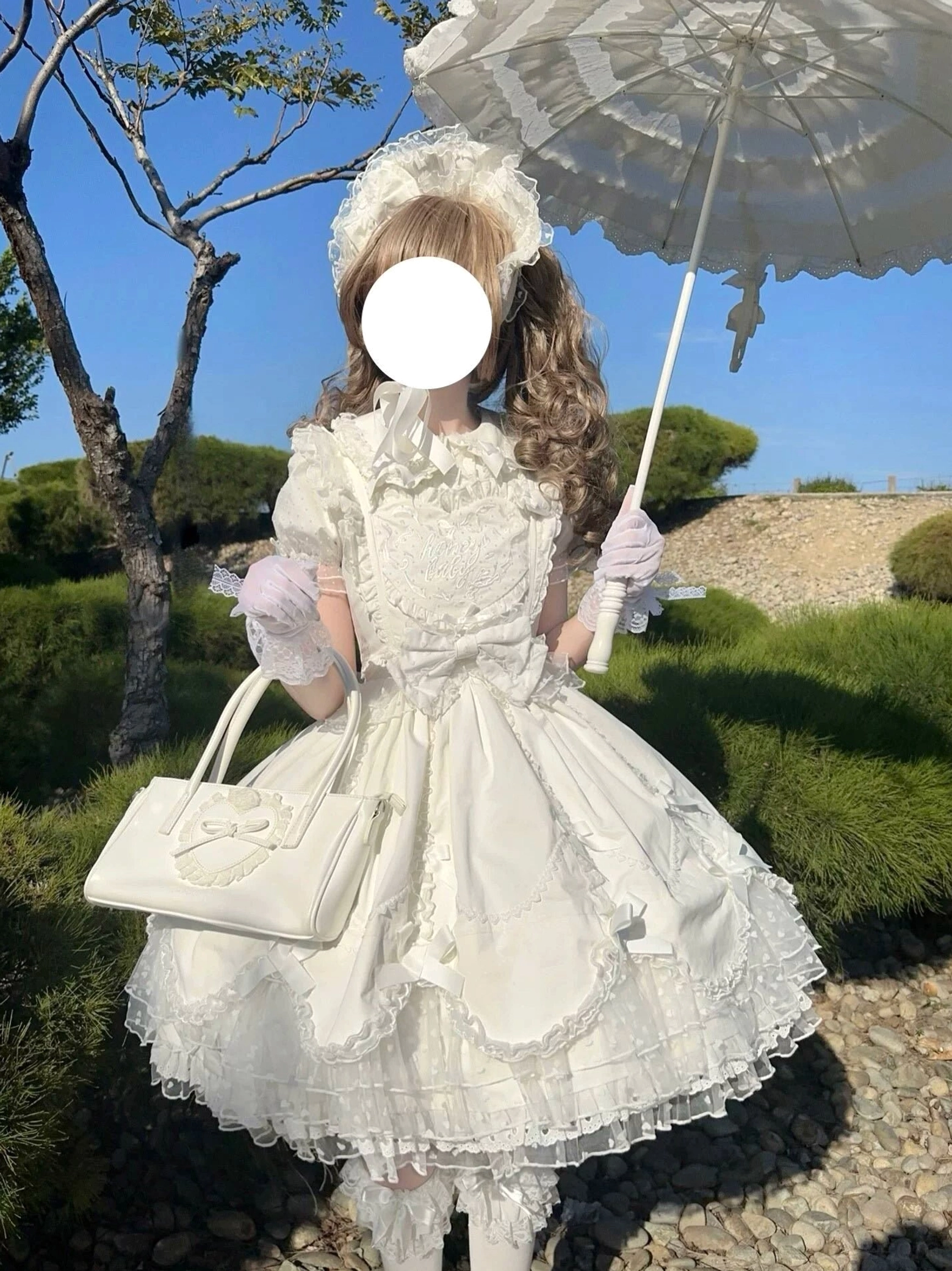 Vintage Lolita short-sleeved blouse with doll collar and delicate lace embroidery small bows displayed