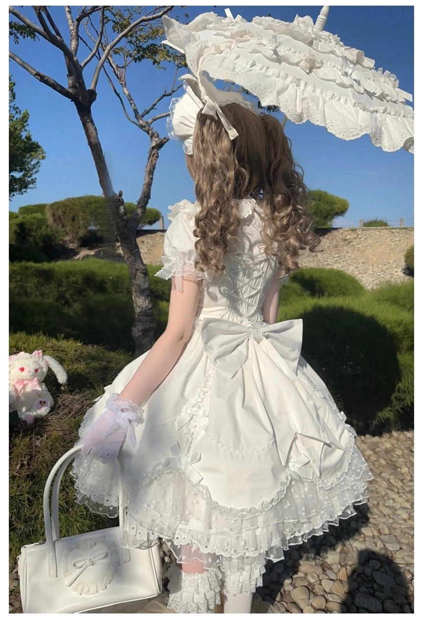 Sweet Lolita dress shoulder strap ruffled detail with recessed aluminum wire bow construction close-up