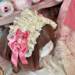 Lolita side hair clip accessory with ivory ruffled lace base and double dusty rose satin bows, displayed on mannequin head against pink vintage wooden shelf background, sweet anime-inspired design