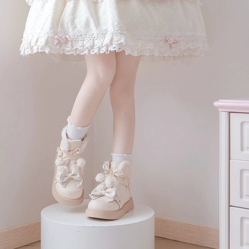 Lolita snow boots with ruffled petticoat and frilly dress skirt complete sweet lolita coordinate winter fashion styling