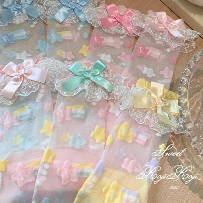 Detail shot lolita star embroidered sock cuff lace ruffles and satin bow accent styling