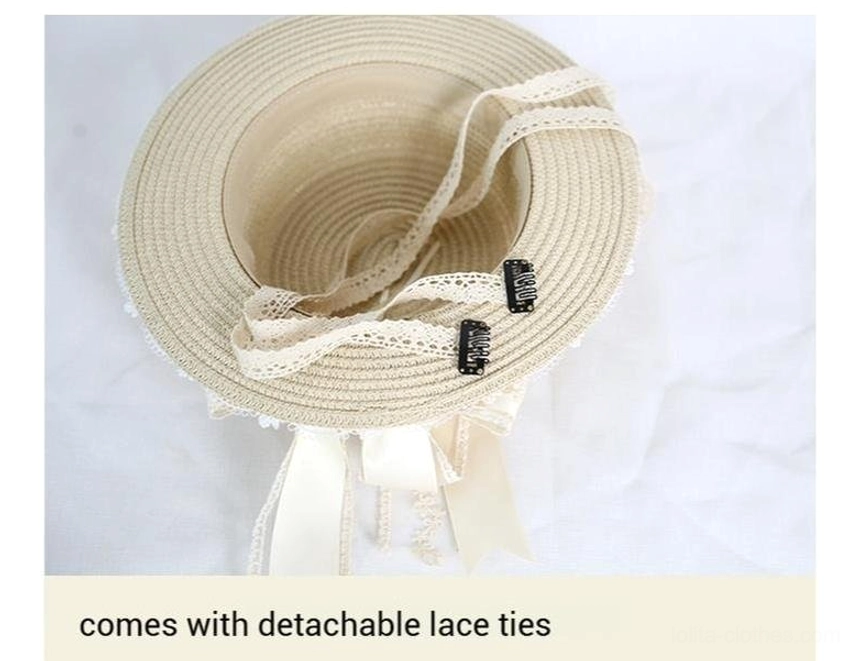 Interior top-down view of lolita lace straw hat showing woven straw structure, included detachable lace tie straps, and secure fixing clips for wearing accessories
